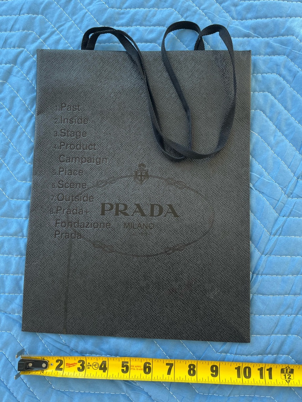 PRADA Fondazione • textured black paper • shopping tote • long ribbon handles •